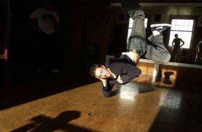 
Nicolas Santonocito, 20, practices break dancing Monday at The Dance Shop. Santonocito and the two other members of his group Tangled Roots and the three members of Vision practice together weekly and will be featured at 7 senses 2004 tonight.
 (Jed Conklin / The Spokesman-Review)
