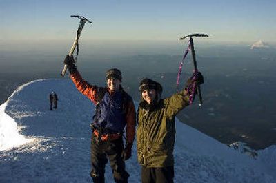 
Jed Conklin, left, and Mark Steward celebrate reaching the 11,249-foot summit of Mount Hood just after sunrise. 
 (The Spokesman-Review)