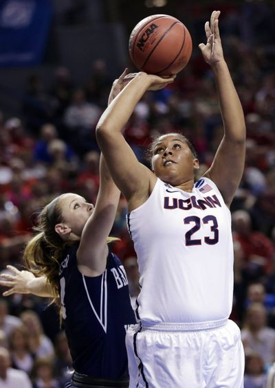 Connecticut's Kaleena Mosqueda-Lewis scores two of her 19 points over BYU's Kim Beeston. (Associated Press)