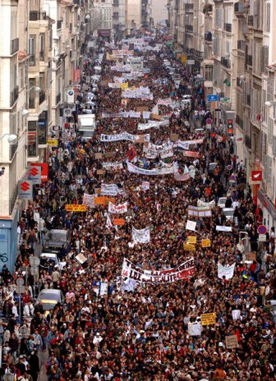 
A nationwide demonstration Tuesday, including here in Marseille, southern France, protested a law that would let companies fire employees under 26 without reason in their first two years.  
 (Associated Press / The Spokesman-Review)