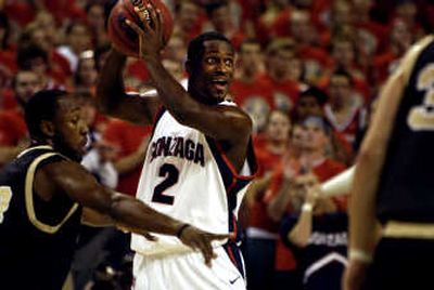
Jeremy Pargo, feeling defensive pressure, makes eye contact with a teammate before delivering a pass against Idaho Tuesday. 
 (Holly Pickett / The Spokesman-Review)