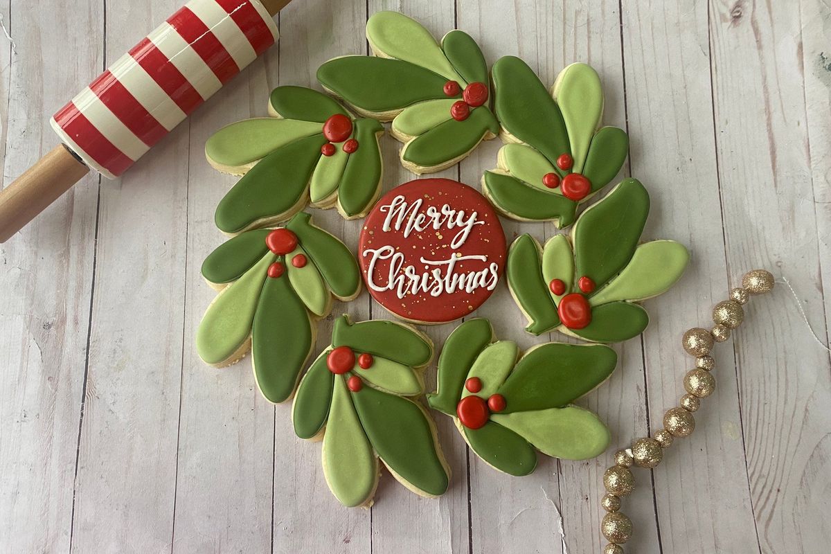Jamie Roberts, owner of Three Birdies Bakery, created this Merry Christmas wreath of cookies. Roberts will teach a few cookie decorating classes this month. (Courtesy)