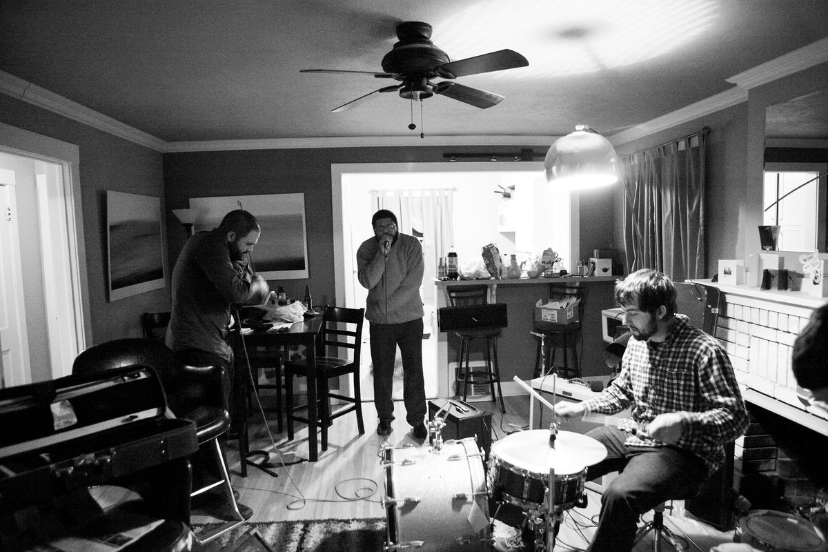 Isamu “Som” Jordan, center, practices with Rajah Bose, left on violin, and Brian Mueller, on drums, at Bose’s home in Spokane in 2010.  (Tyler Tjomsland/The Spokesman-Review)