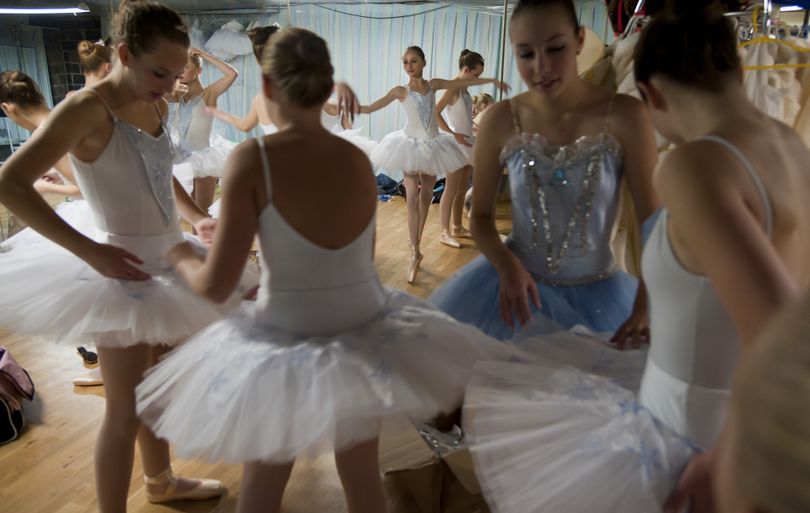 Company Ballet School dancers get into costume before rehearsal for “The Nutcracker” on Nov. 7 in Millwood. (PHOTOS BY COLIN MULVANY)