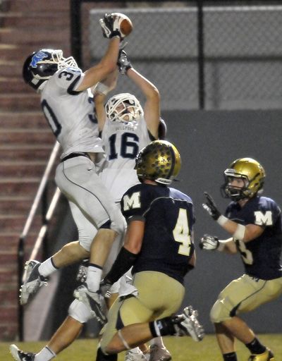 Gonzaga Prep’s Trevor Cote (30) intercepts a Hail Mary pass in the end zone with 3 seconds to go. (Jesse Tinsley)