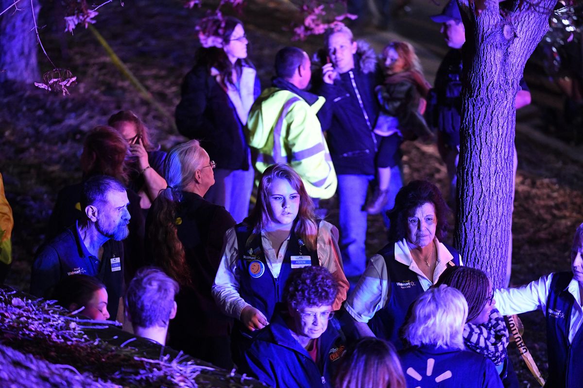 Walmart employees gather together outside away from the scene of the Walmart store where a shooting occurred Wednesday, Nov. 1, 2017, in Thornton, Colo. (Helen H. Richardson / Associated Press)