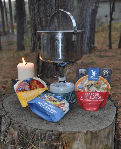 A camping stove and heat-in-pouch food makes a quick meal in the field or in an urban emergency. (Rich Landers / The Spokesman-Review)