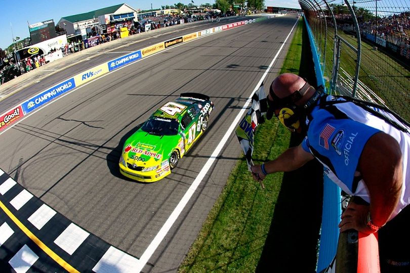 Marcos Ambrose captures his third consecutive NASCAR Nationwide Series checkered flag at Watkins Glen International -- tying Terry Labonte's streak from 1994-1996 on Saturday in Watkins Glen, N.Y. (Photo courtesy of Kevin C. Cox/Getty Images) (Kevin Cox / Getty Images North America)