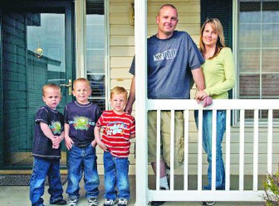
From left, 5-year-old twins Trevor and Travis, 3-year-old Trenton, Scott and Corinna Whitaker moved from Las Vegas to Spokane in February after Scott was hired as a Spokane Valley firefighter. 
 (Holly Pickett / The Spokesman-Review)