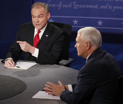 Republican vice-presidential nominee Gov. Mike Pence, right, and Democratic vice-presidential nominee Sen. Tim Kaine speak during the vice-presidential debate at Longwood University in Farmville, Va., Tuesday, Oct. 4, 2016. (Andrew Gombert / AP)