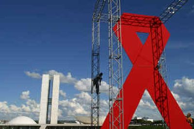 
Men assemble of a big red bow, the symbol of the AIDS World Movement, in front of the Brazilian National Congress, in Brasilia, Brazil, on Tuesday . The monument will be displayed until December 1, in commemoration of World AIDS Day.Men assemble of a big red bow, the symbol of the AIDS World Movement, in front of the Brazilian National Congress, in Brasilia, Brazil, on Tuesday . The monument will be displayed until December 1, in commemoration of World AIDS Day.
 (Associated Press Associated Press / The Spokesman-Review)