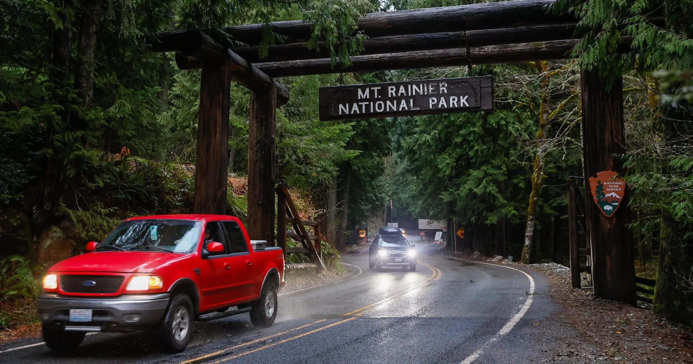 A giant wooden sign welcomes visitors to Mount Rainier National Park at the Nisqually Entrance. A nearby lodging option has been shut down because of safety violations. (Jennifer Buchanan / / Seattle Times)