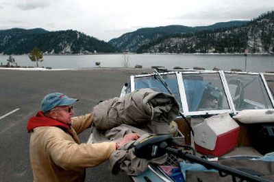 
Bob Shelton of Spokane ties down his boat Tuesday after fishing Wolf Lodge Bay on Lake Coeur d'Alene. Idaho Health and Welfare advisories say anglers should limit the amount of fish they eat from lakes.
 (Jesse Tinsley / The Spokesman-Review)