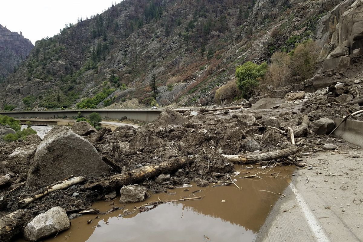 This image provided by the Colorado Department of Transportation shows mud and debris on U.S. Highway 6 on Sunday west of Silver Plume, Colo. Mudslides closed some Colorado highways as forecasters warned of potential flash flooding on Sunday across the Rocky Mountain and Great Basin regions.  (HOGP)
