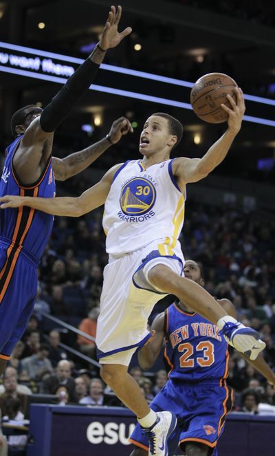 Warriors guard Stephen Curry scored 29 points in 125-119 loss to Knicks. (Associated Press)