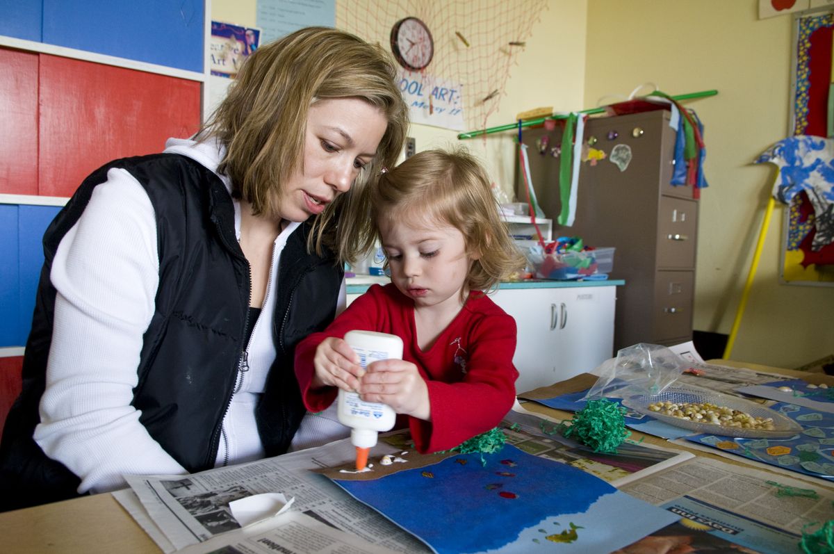 At the South Spokane Co-Op Christy Nolting and her daughter Peyton, 3, work together on a sea life scene. Preschool co-ops allow parents to take part in their children’s education. (Colin Mulvany / The Spokesman-Review)