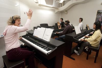 Instructor Rosi Guerrero works with students Thursday in the piano lab of Spokane Falls Community College’s aging music building. Gov. Chris Gregoire’s economic stimulus proposal includes $13.8 million to expand and renovate the building.  (Colin Mulvany / The Spokesman-Review)