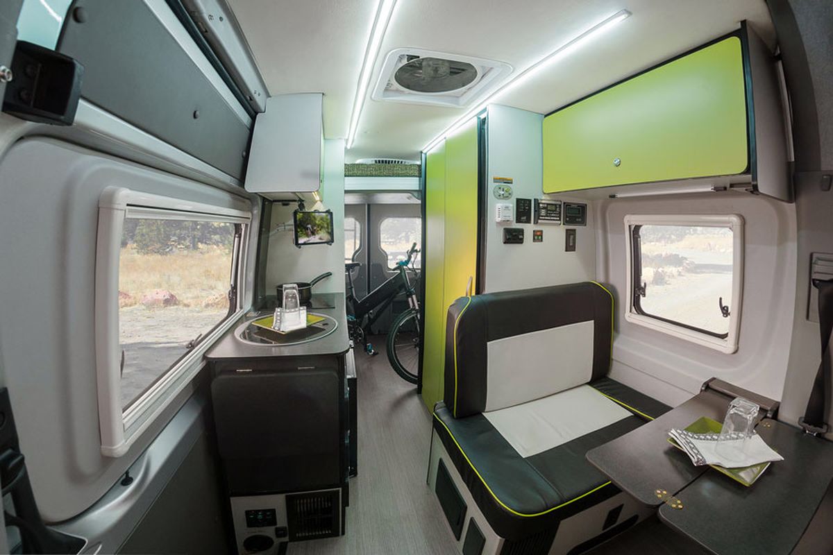 The Revel layout offers a separate living space behind the driver's seat. 
 (Courtesy Winnebago)