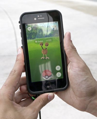 AP
FILE - In this July 12, 2016, file photo, Doduo, a Pokemon, is found by a group of Pokemon Go players using a smartphone, at Bayfront Park in downtown Miami. (Alan Diaz / Associated Press)