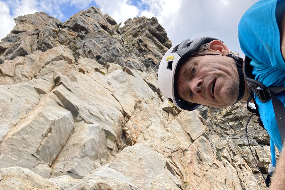 Hugh Safford, an ecologist for the U.S. Forest Service, prepares to lead the crux pitch on the southwest ridge of Symmetry Spire in Grand Teton National Park.  (Photo courtesy of William Brock)