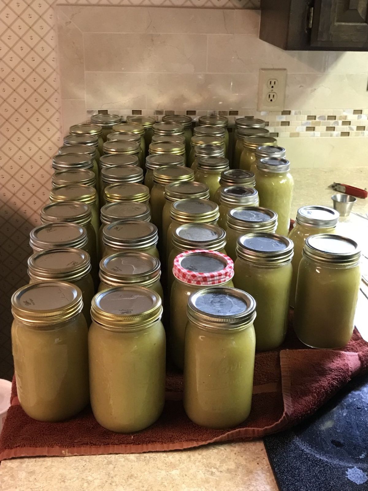 In the Pettit kitchen, some of last year’s apple harvest that was turned into applesauce is long since consumed. Jars are empty, awaiting this year’s canning process.  (Stefanie Pettit/For The Spokesman-Review)