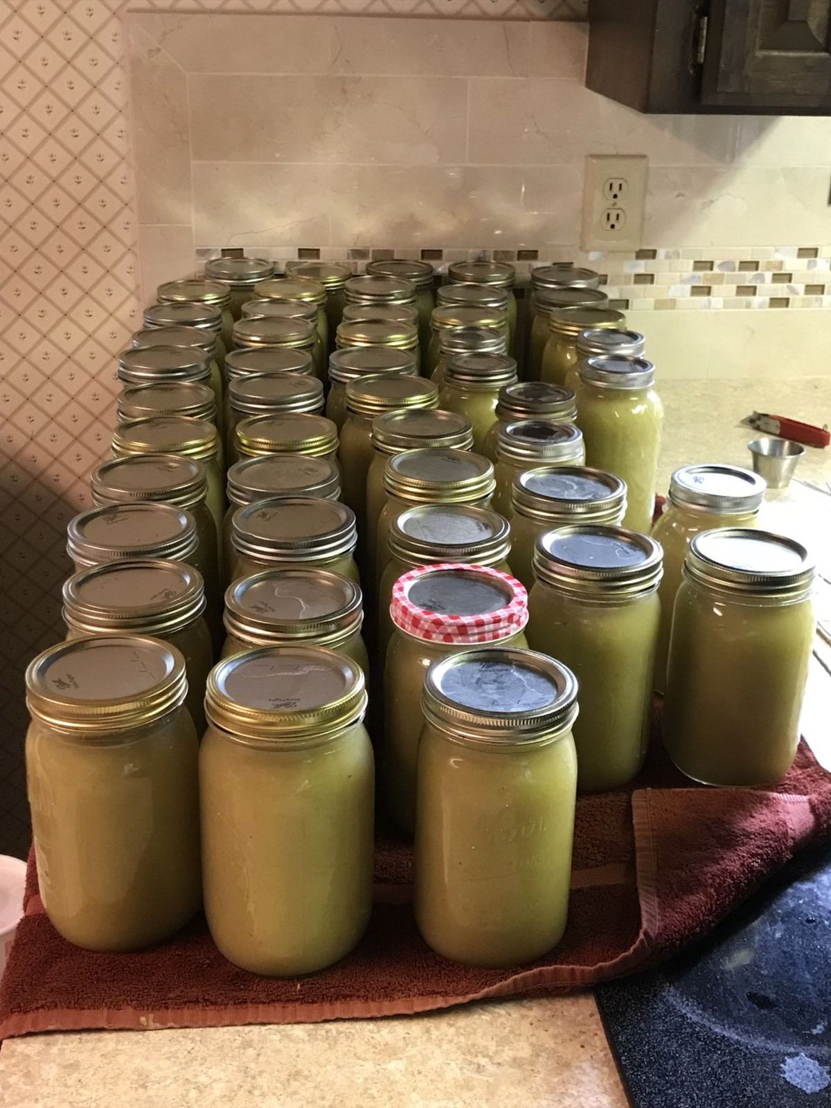 In the Pettit kitchen, some of last year’s apple harvest that was turned into applesauce is long since consumed. Jars are empty, awaiting this year’s canning process. (Stefanie Pettit/For The Spokesman-Review)