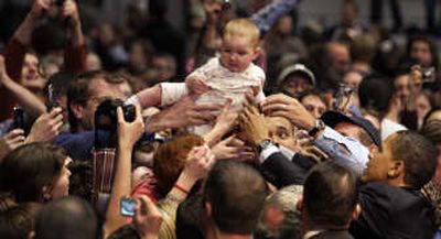 
Sen. Barack Obama reaches for 8-month-old Natalie Pankratz-Osborn, of Missoula, at a rally at the Adams Center at the University of Montana on Saturday. Associated Press
 (Associated Press / The Spokesman-Review)