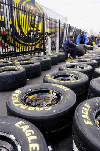 
Goodyear Eagle race tires line pit row during practice at Atlanta Motor Speedway in a Hampton, Ga., earlier this year. Goodyear Tire & Rubber Co. said Friday it will close an undisclosed number of plants as part of a sweeping restructuring.
 (Associated Press / The Spokesman-Review)