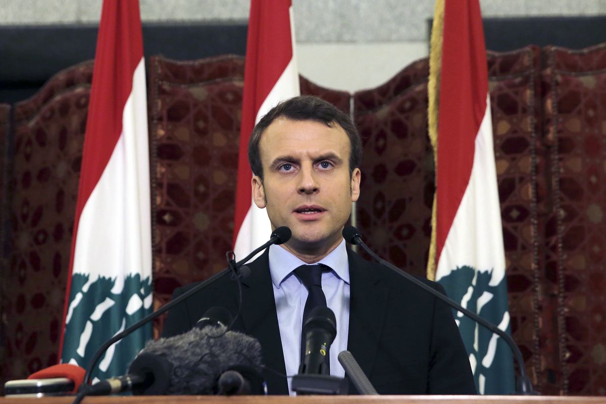 FILE - In this Tuesday, Jan. 24, 2017 file photo, French presidential candidate and former French Economy Minister Emmanuel Macron speaks during a press conference at the Government House, in downtown Beirut, Lebanon. French President Emmanuel Macron is traveling to Lebanon on Thursday Aug. 6, 2020, to offer support for the country after the massive, deadly explosion in Beirut. Lebanon is a former French protectorate and the countries retain close political and economic ties.  (Bilal Hussein)