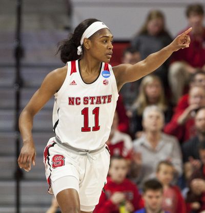 In this March 16, 2018, file photo, North Carolina State’s Kiara Leslie (11) points to a teammate after hitting a 3-pointer during the first half of a first-round game in the NCAA women’s college basketball tournament against Elon in Raleigh, N.C. The wins keep adding up for Kiara Leslie and eighth-ranked North Carolina State. The Wolfpack women – not traditional powers Connecticut or reigning national champion Notre Dame – stand as Division I’s last unbeaten team. (Ben McKeown / Associated Press)