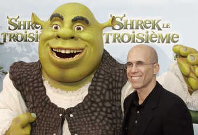 DreamWorks Animation SKG Jeffrey Katzenberg poses with the character Shrek for photographers during a media event before the evening's premier of 