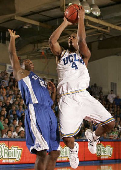 
UCLA's Arron Afflalo, right, pulls up for a shot over Kentucky's Jodie Meeks.
 (Associated Press / The Spokesman-Review)