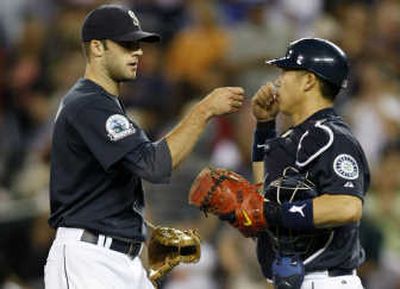 
Mariners catcher Kenji Johjima, right, congratulates pitcher Brandon Morrow after Friday's victory over Oakland. Associated Press
 (Associated Press / The Spokesman-Review)