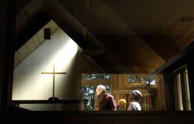 
Clayton Flueckinger, left, 66, and Dick Thomas, 69, discuss construction at Beautiful Savior Lutheran Church while Bob Montle, 74, works in the background. 
 (Jed Conklin / The Spokesman-Review)