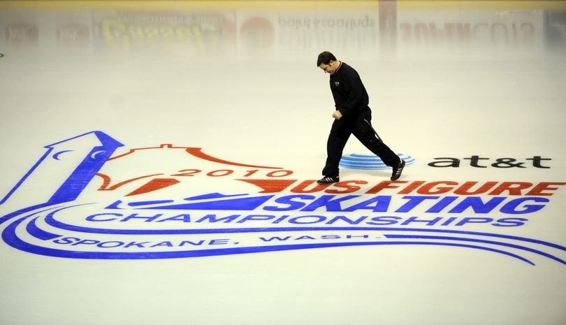 jesset@spokesman.com Jon Chambers, an operations supervisor for the public facilities district that operates the Spokane Arena, slides across the ice while working on the rinkboards at the Spokane Arena on Tuesday. The 10-day AT&T U.S. Figure Skating Championships start this week. (Jesse Tinsley)