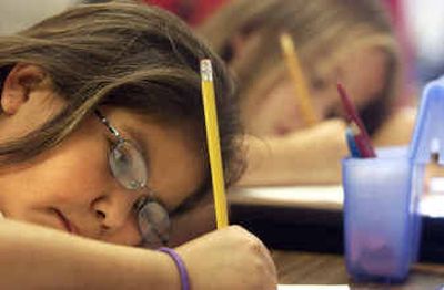 
Fourth-grader KayLeena Allery concentrates while working on a writing assignment Friday afternoon at Lakeside Elementary in Worley. The school, because of its improvements with special education, students with limited English and Native American students, was taken off the 