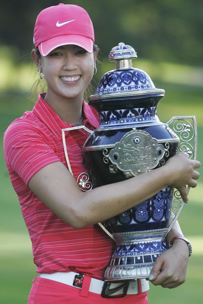 Michelle Wie, from the United States, won the Lorena Ochoa Invitational by two strokes over Paula Creamer. (Associated Press)
