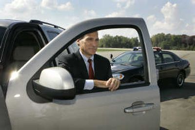
OnStar President Chet Huber stands next to a Chevrolet Tahoe after a news conference at the General Motors Milford Proving Grounds in Milford, Mich. Starting with many GM 2009 models, if someone steals your vehicle and it's equipped with OnStar service, the service will be able to slow the car down to a halt, and it may even have a voice come from the radio telling thieves to pull over because the cops are on their trail. Associated Press photos
 (Associated Press photos / The Spokesman-Review)