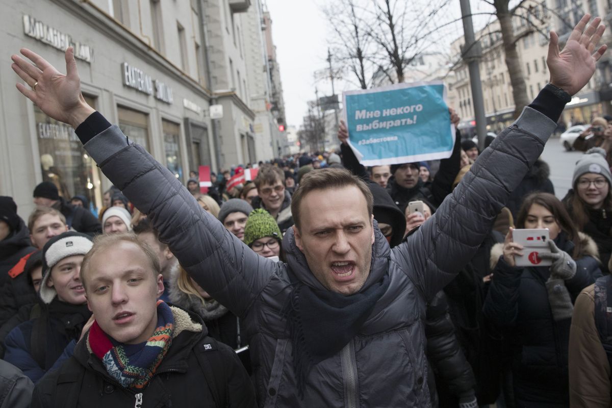 Russian opposition leader Alexei Navalny, center, attends a rally Jan. 28, 2018, in Moscow, Russia. Navalny is an anti-corruption campaigner and the Kremlin’s fiercest critic. He has outlasted many opposition figures and is undeterred by incessant attempts to stop his work.  (Evgeny Feldman)