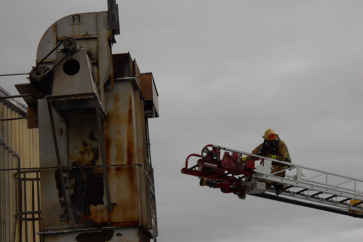 Crews from the Spokane Valley Fire Department put out a metal shavings collection bag fire at Spur Industries in the Spokane Valley Industrial Park on Nov. 22, 2011. (Photo courtesy the Spokane Valley Fire Department)