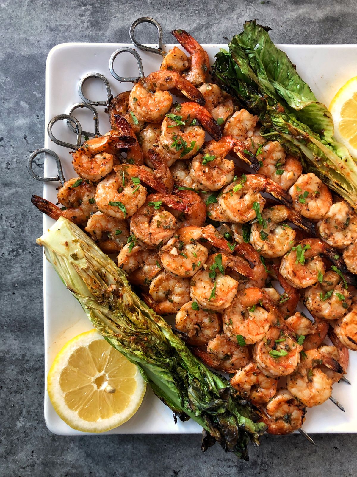 Take advantage of outdoor cooking and dining with these grilled shrimp skewers.  (Audrey Alfaro/For The Spokesman-Review)