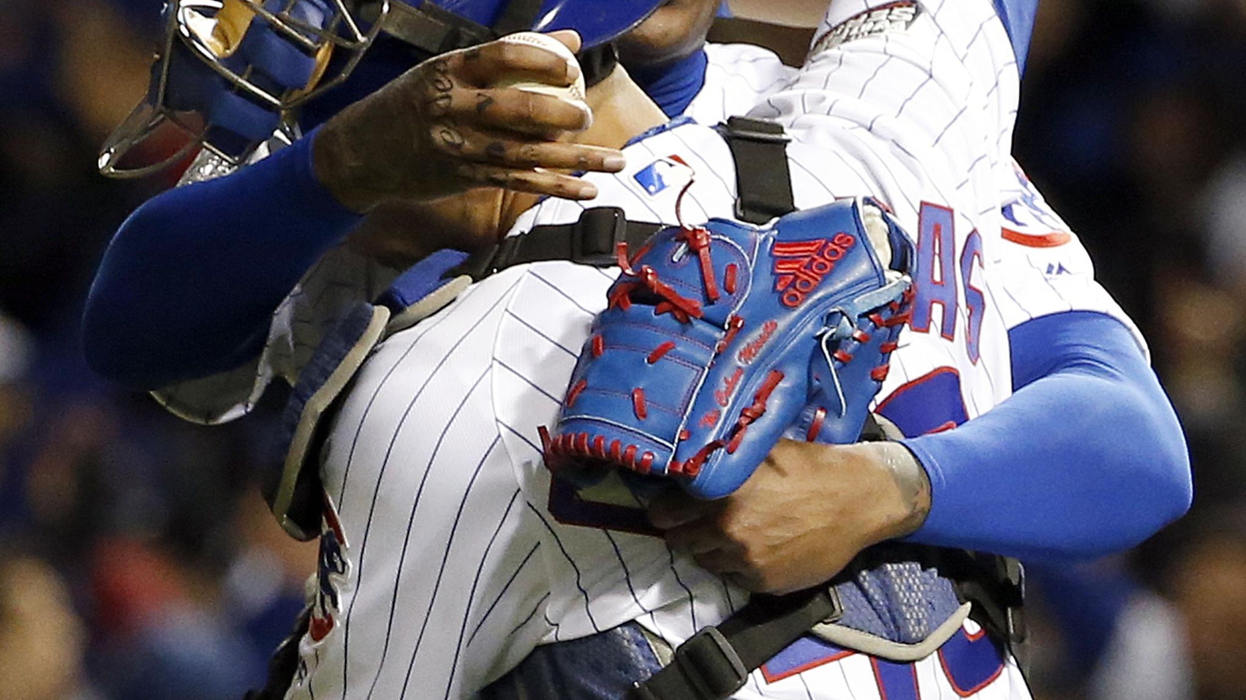 Chicago Cubs relief pitcher AROLDIS CHAMPMAN throws a strike