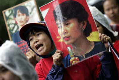 
A Myanmar citizen living in Japan, holding a photograph of opposition leader Aung San Suu Kyi, takes part in a protest march against Myanmar's military junta in downtown Tokyo on Sunday. Associated Press
 (Associated Press / The Spokesman-Review)