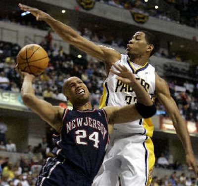 
Indiana's Danny Granger fouls New Jersey's Richard Jefferson.  
 (Associated Press / The Spokesman-Review)