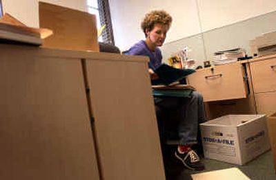 
Former Spokane County Commissioner Kate McCaslin cleans out her desk Thursday afternoon after stepping down after eight years in office. 
 (Brian Plonka / The Spokesman-Review)