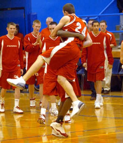 
The Spokesman-Review Jared Karstetter jumps into DeAngelo Casto's arms after win.
 (Jesse Tinsley / The Spokesman-Review)