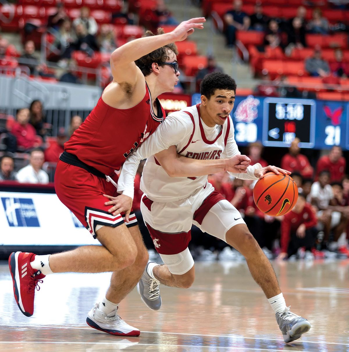 Washington State guard Myles Rice drives around Eastern Washington’s Casey Jones on Nov. 27 at Beasley Coliseum in Pullman.  (Geoff Crimmins/THE SPOKESMAN-REVIEW)