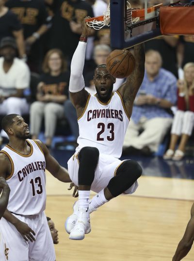 In this June 16, 2016, file photo, Cleveland Cavaliers forward LeBron James (23) dunks against the Golden State Warriors during the first half of Game 6 of basketball's NBA Finals in Cleveland. James is a free agent after declining his player option for next season with the NBA champion Cavaliers. The move was expected by James, who said last week he intends to remain with Cleveland. (Ron Schwane / Associated Press)