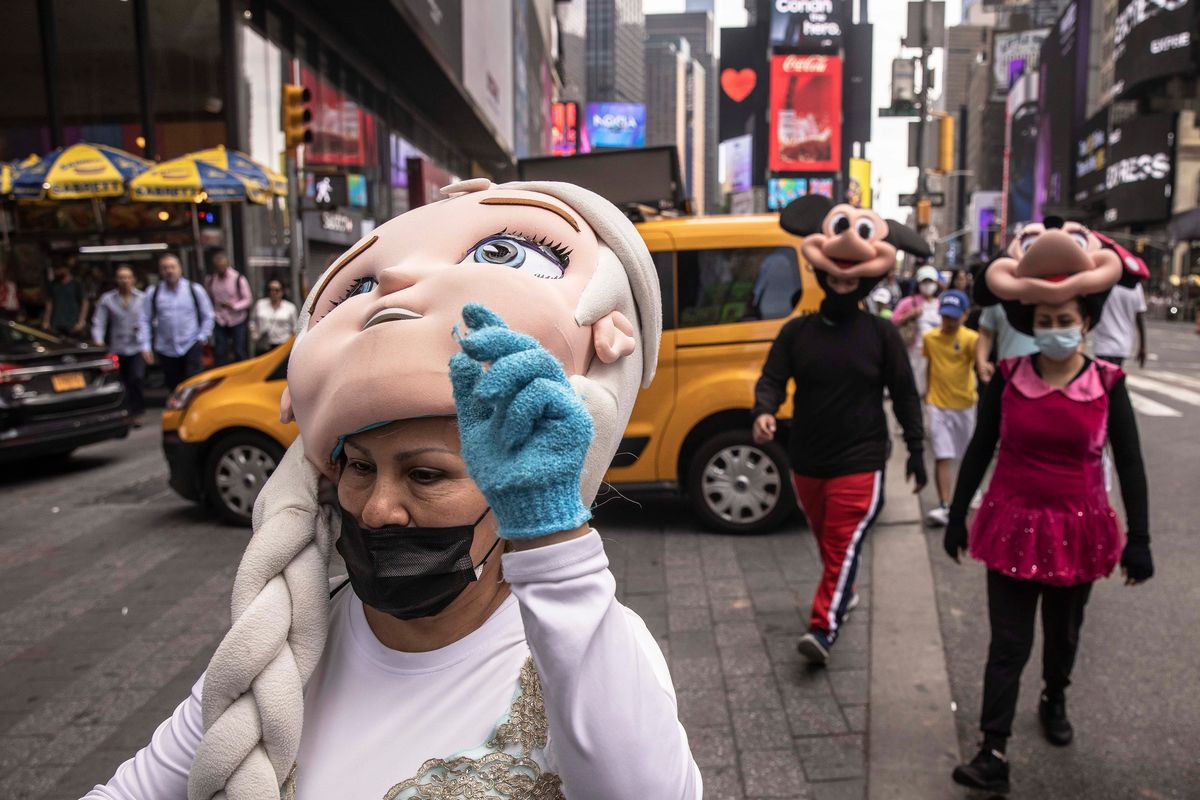 People working as costumed characters wear face masks in Times Square as smoke from Canadian wildfires moves through the city in Manhattan, June 29, 2023. (Dave Sanders/The New York Times)  (DAVE SANDERS)