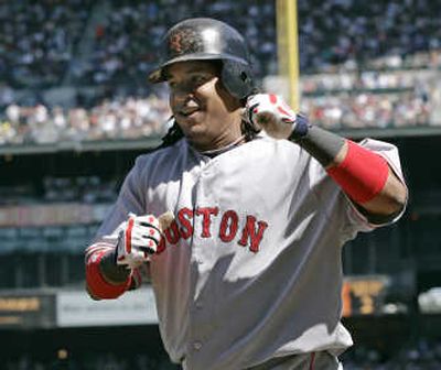 Boston Red Sox's Manny Ramirez smiles as he heads to the dugout after hitting a solo home run Sunday afternoon. Associated Press
(Associated Press / The Spokesman-Review)